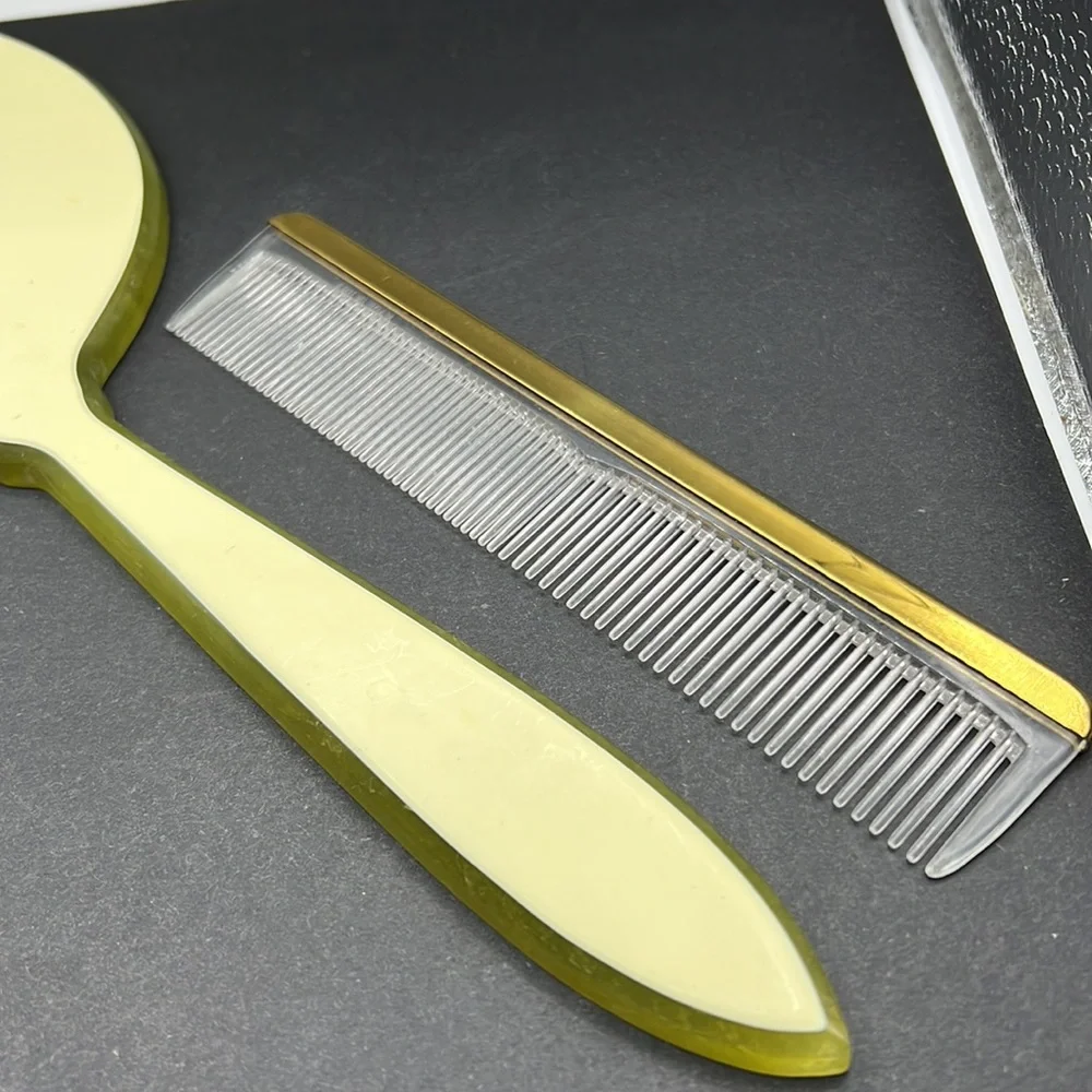 Vintage green celluloid hand mirror and comb set